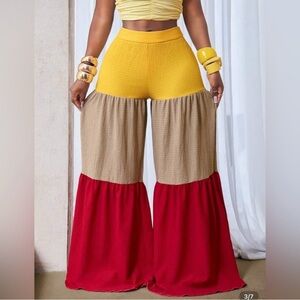 Palazzo/Wide Leg Pants Red, Yellow, and Tan. Zipper. Material does stretch.